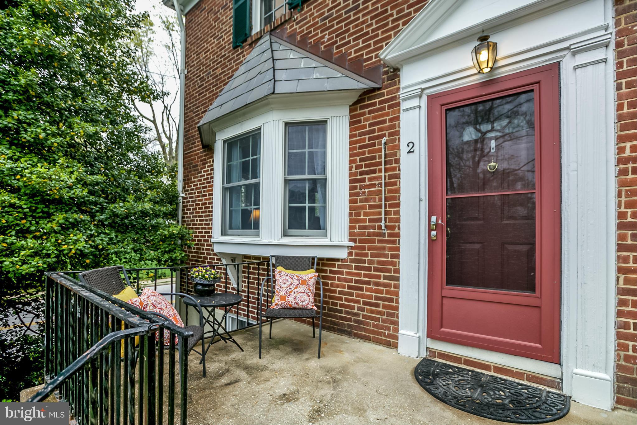 2 Dunkirk Road Baltimore, MD 21212 - Photo 3 of 29 a front view of a house with a bench