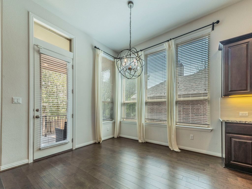 244 Fort Cobb Way Georgetown, TX 78628 - Photo 11 of 29 a view of an empty room with a kitchen and a window