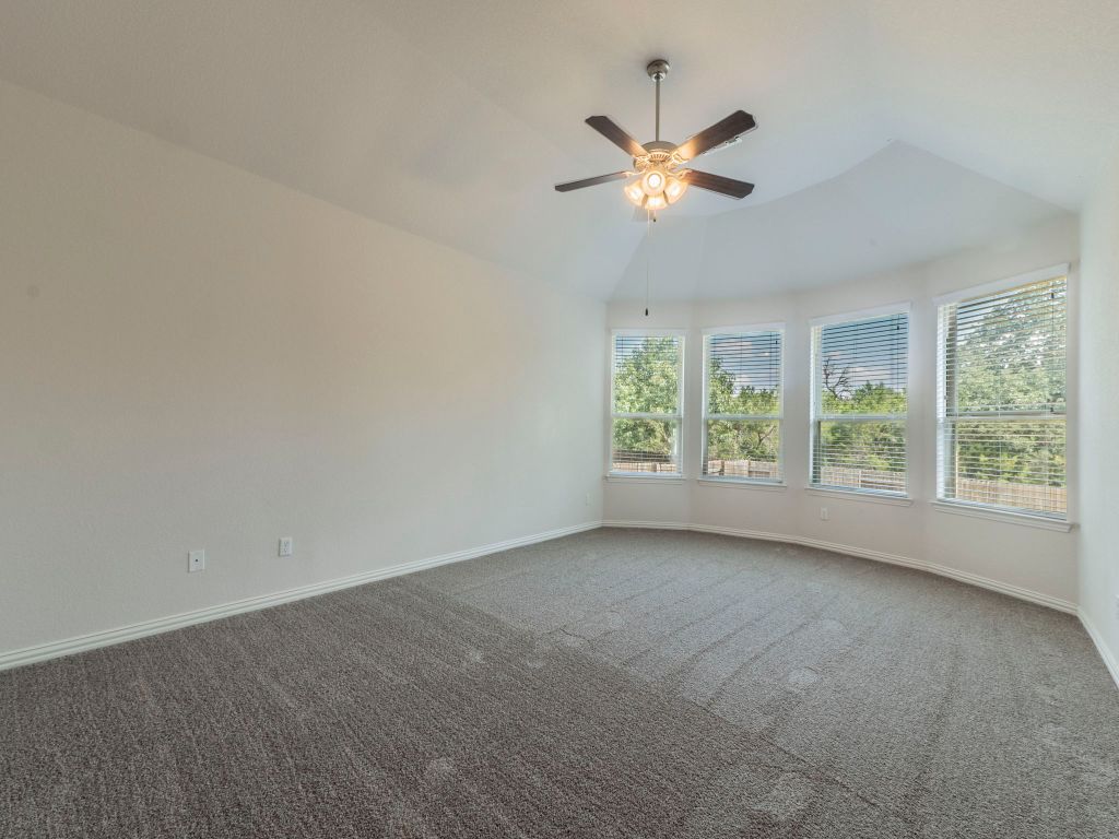 244 Fort Cobb Way Georgetown, TX 78628 - Photo 12 of 29 a view of a livingroom with a ceiling fan and window