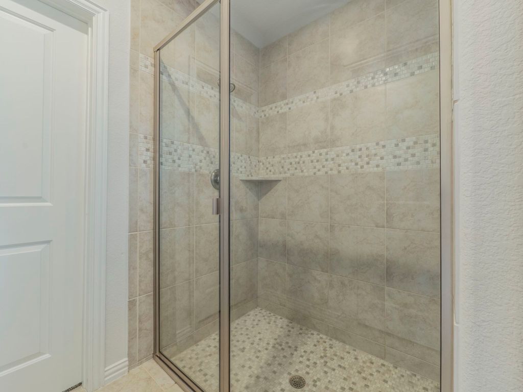 244 Fort Cobb Way Georgetown, TX 78628 - Photo 16 of 29 a bathroom with a shower