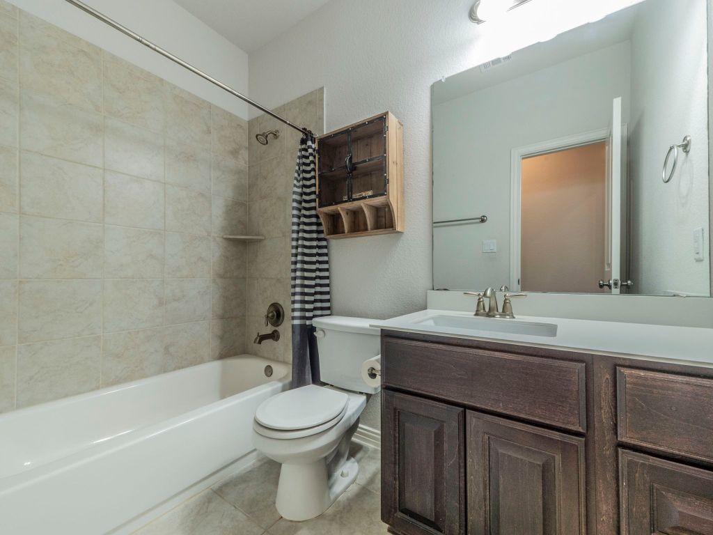 244 Fort Cobb Way Georgetown, TX 78628 - Photo 18 of 29 a bathroom with a sink toilet and shower