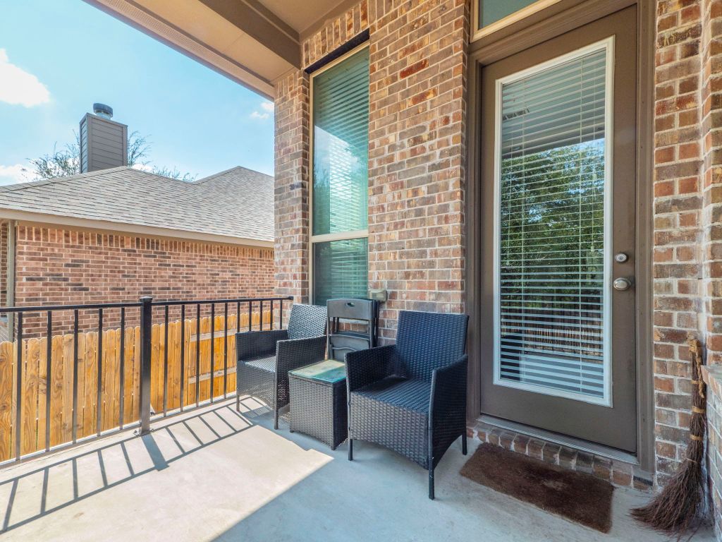 244 Fort Cobb Way Georgetown, TX 78628 - Photo 25 of 29 a balcony with chairs and a table