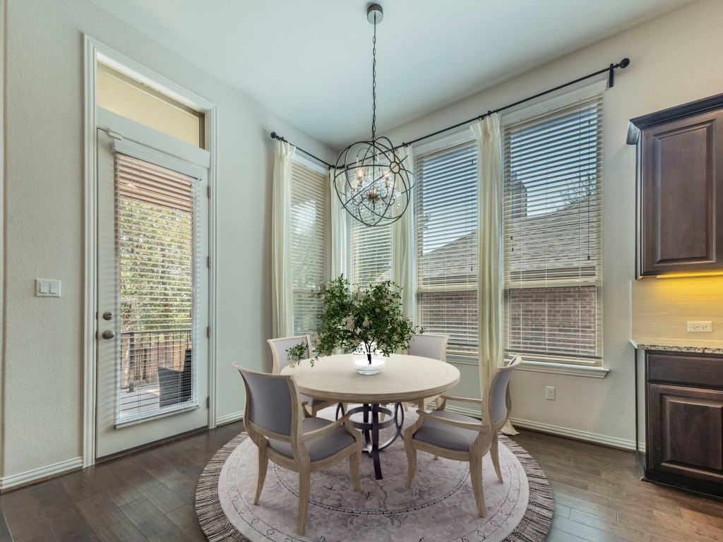 244 Fort Cobb Way Georgetown, TX 78628 - Photo 4 of 29 a view of a dining room with furniture window and wooden floor