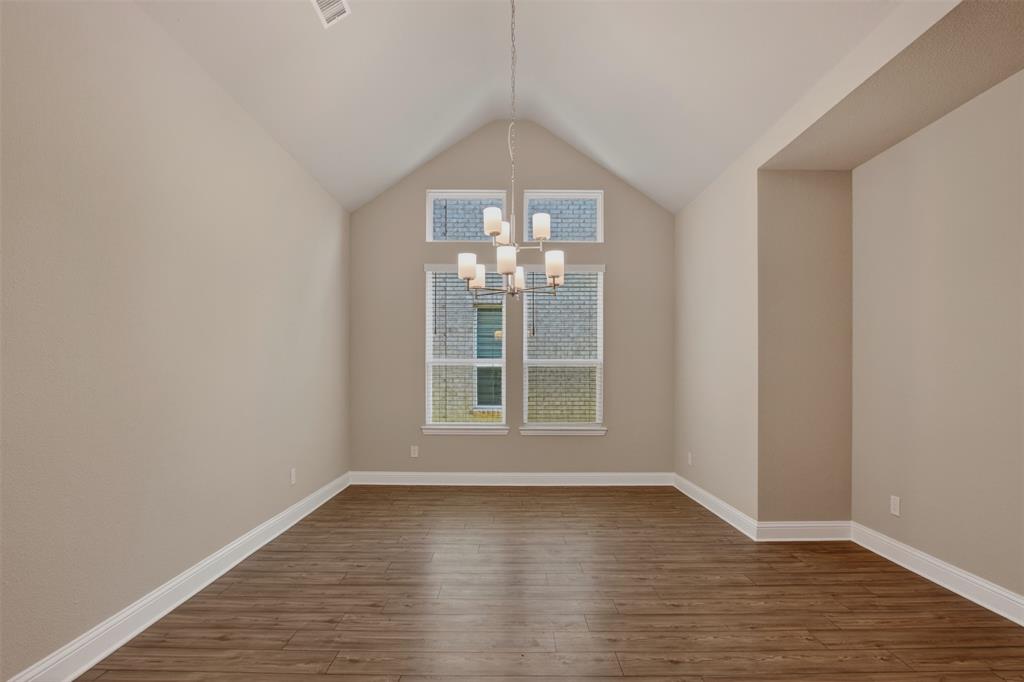16812 Bitterroot Road Justin, TX 76247 - Photo 10 of 27 wooden floor in an empty room with a window