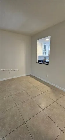 an empty room with large window