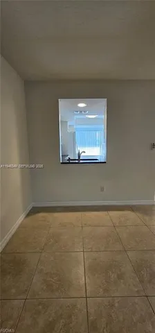 a view of an empty room and window