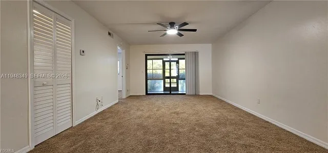 a view of an empty room and window