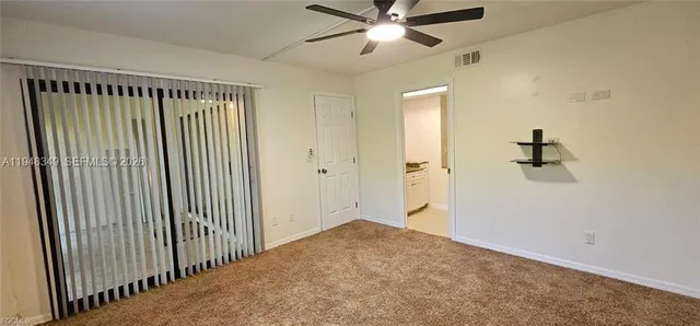 a bathroom with a granite countertop sink a mirror and a shower