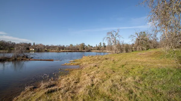 a view of lake with green space