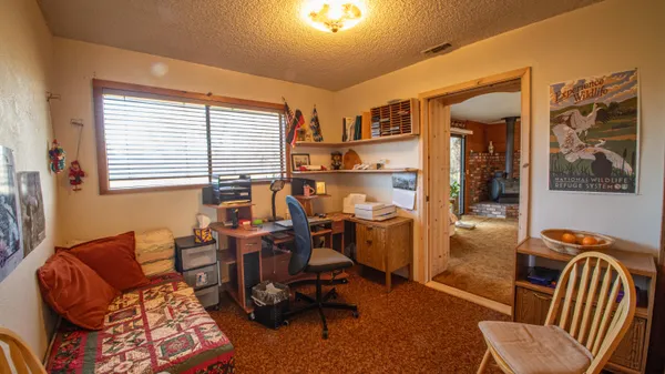 a workspace with furniture and a window
