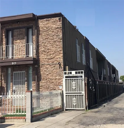 a view of a brick building with many windows