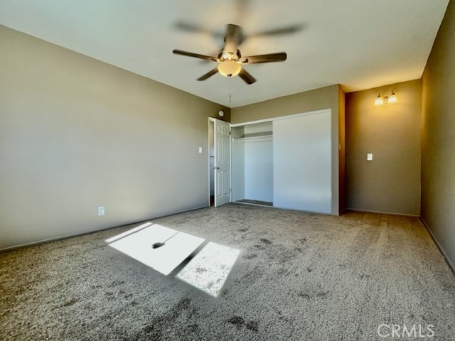 815 North Rose Avenue, Unit J Compton, CA 90221 - Photo 17 of 22 an empty room with a ceiling fan and window