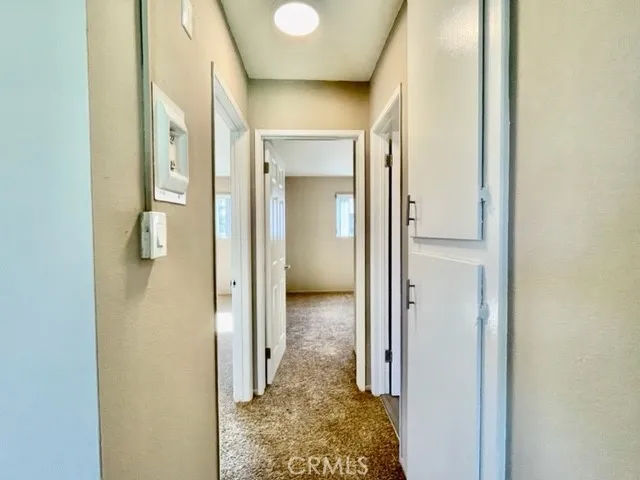 a view of a bathroom from a hallway