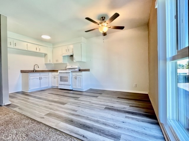 815 North Rose Avenue, Unit J Compton, CA 90221 - Photo 10 of 22 a view of kitchen with sink and wooden floor