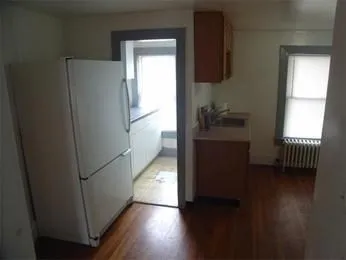 a kitchen with a refrigerator and a stove