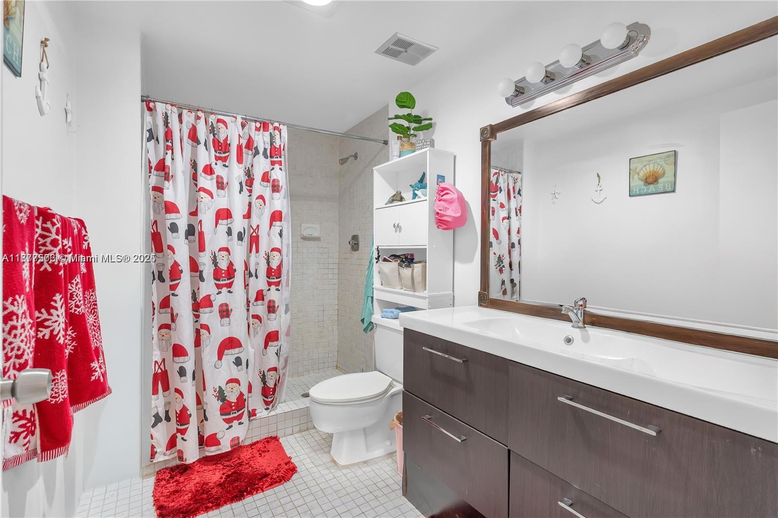 491 Ives Dairy Road, Unit 2025 Miami, FL 33179 - Photo 7 of 20 a bathroom with a sink toilet and shower