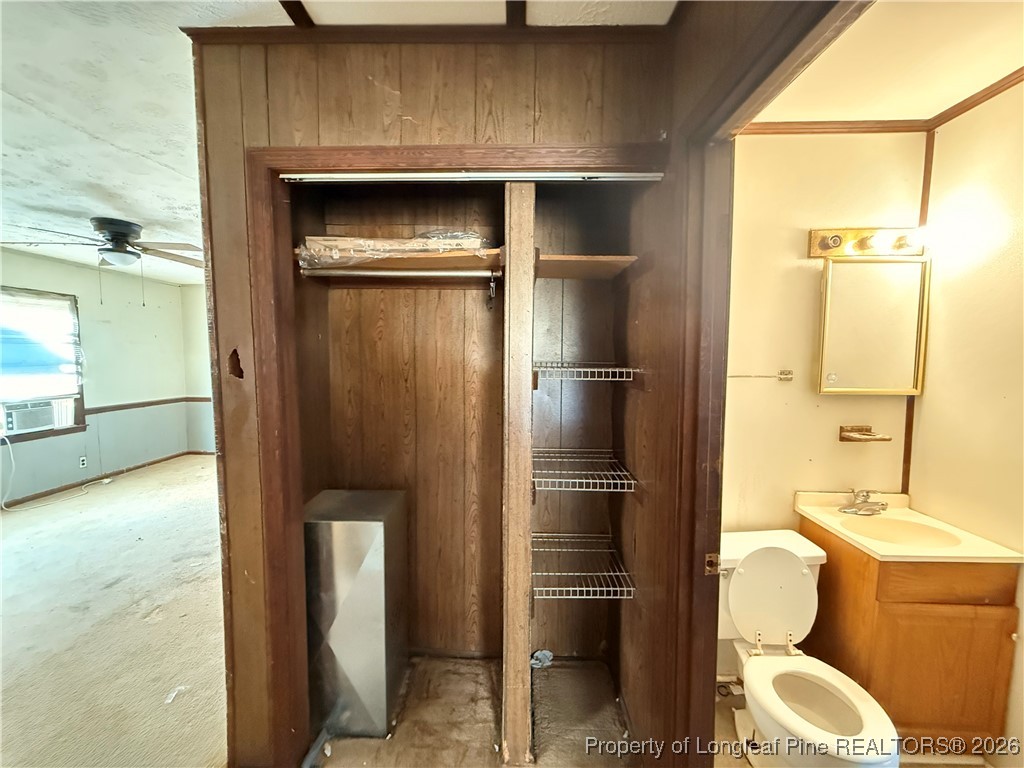 631 Bethel Baptist Road Spring Lake, NC 28390 - Photo 12 of 20 a bathroom with a toilet sink and a shower