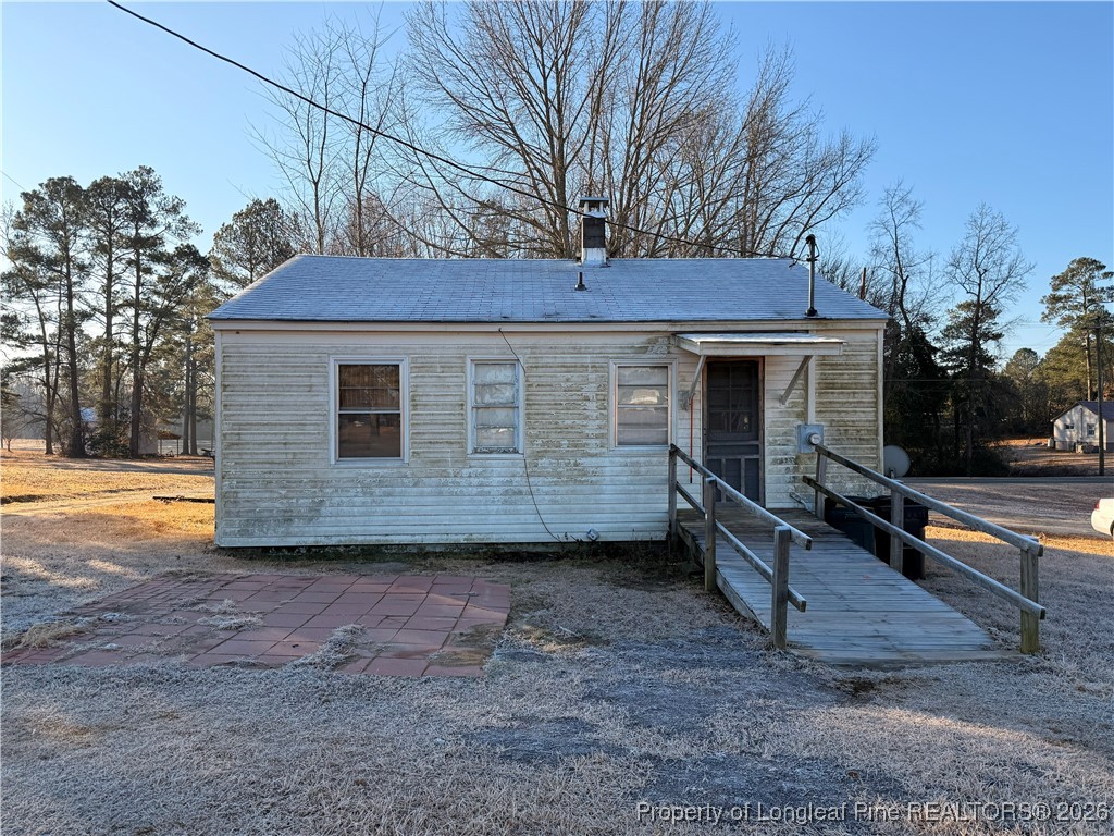 631 Bethel Baptist Road Spring Lake, NC 28390 - Photo 13 of 20 a view of a house with backyard and trees