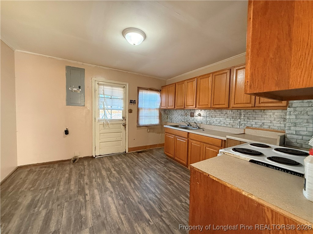 631 Bethel Baptist Road Spring Lake, NC 28390 - Photo 2 of 20 a kitchen with wooden floors and refrigerator