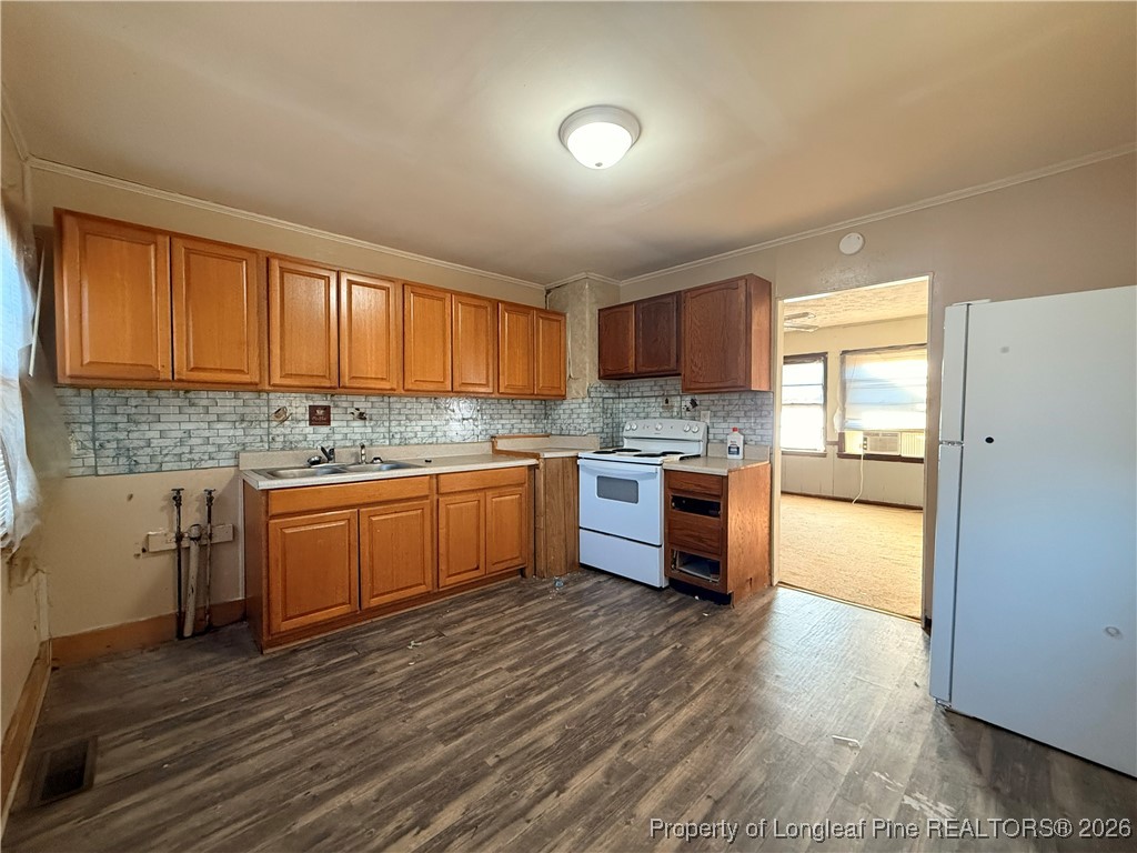 631 Bethel Baptist Road Spring Lake, NC 28390 - Photo 3 of 20 a kitchen with granite countertop a stove cabinets and wooden floor