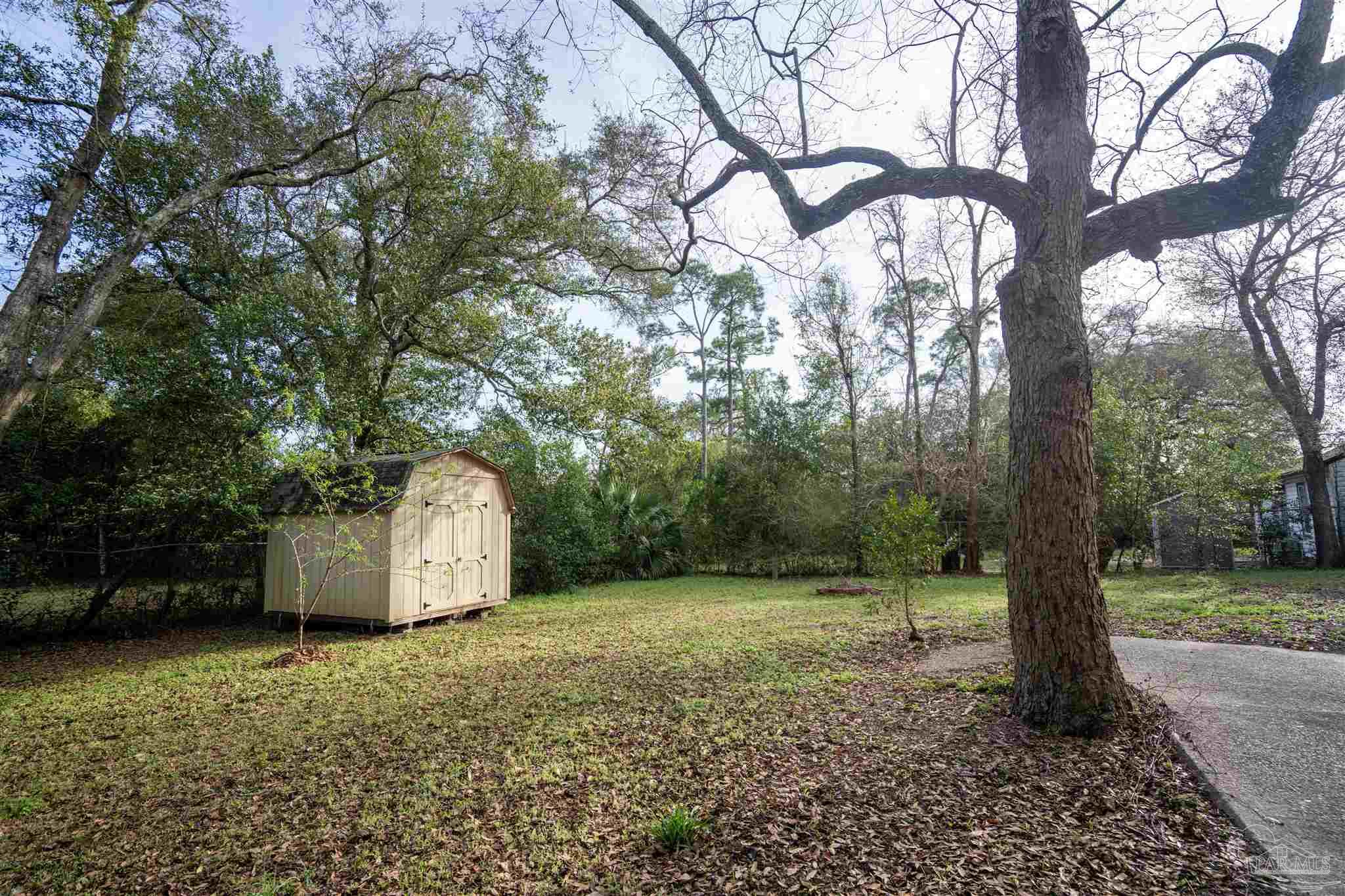 409 Frisco Road Pensacola, FL 32507 - Photo 20 of 27 a view of a field with a tree