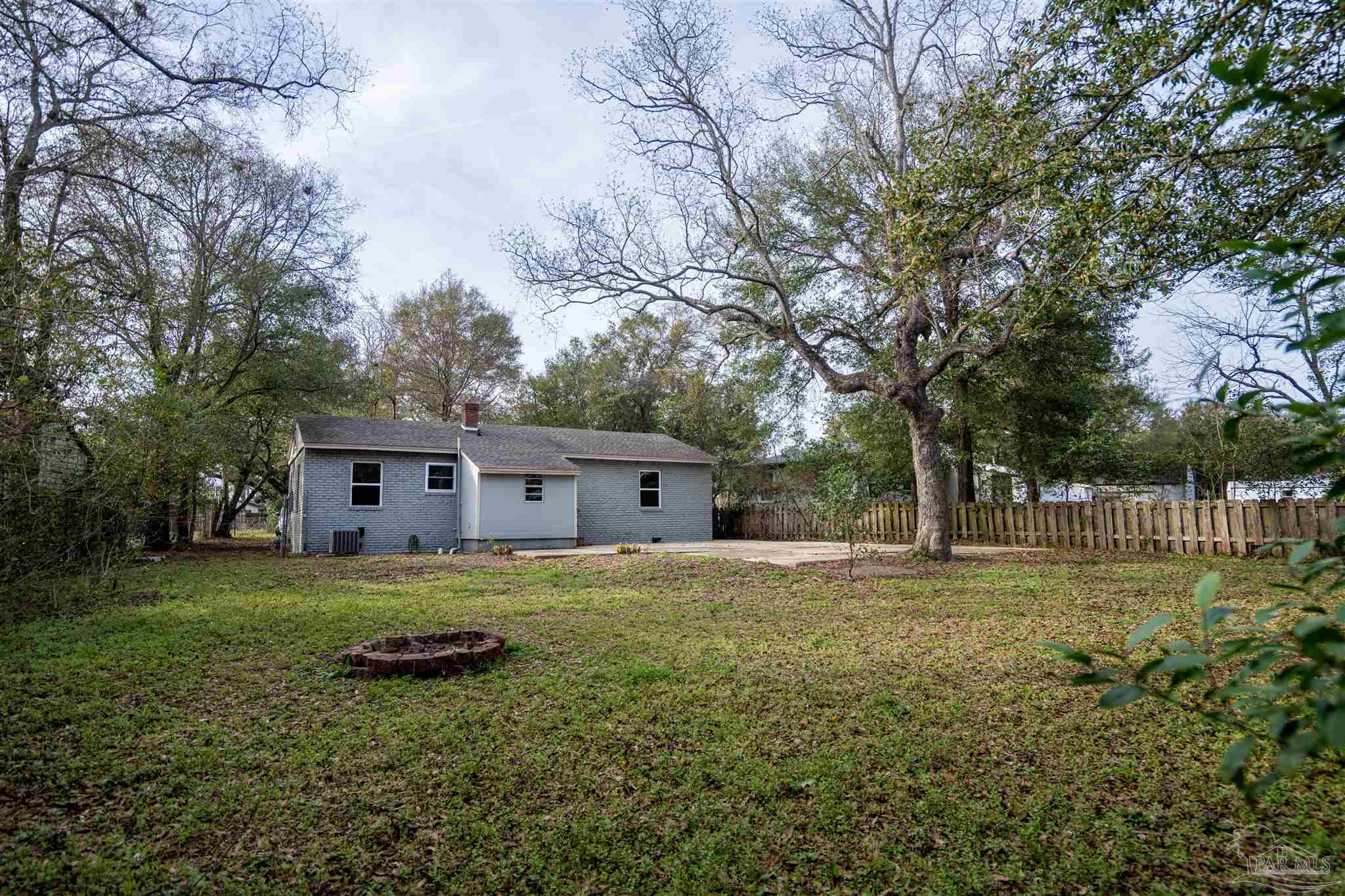 409 Frisco Road Pensacola, FL 32507 - Photo 21 of 27 a house view with a sitting space and garden