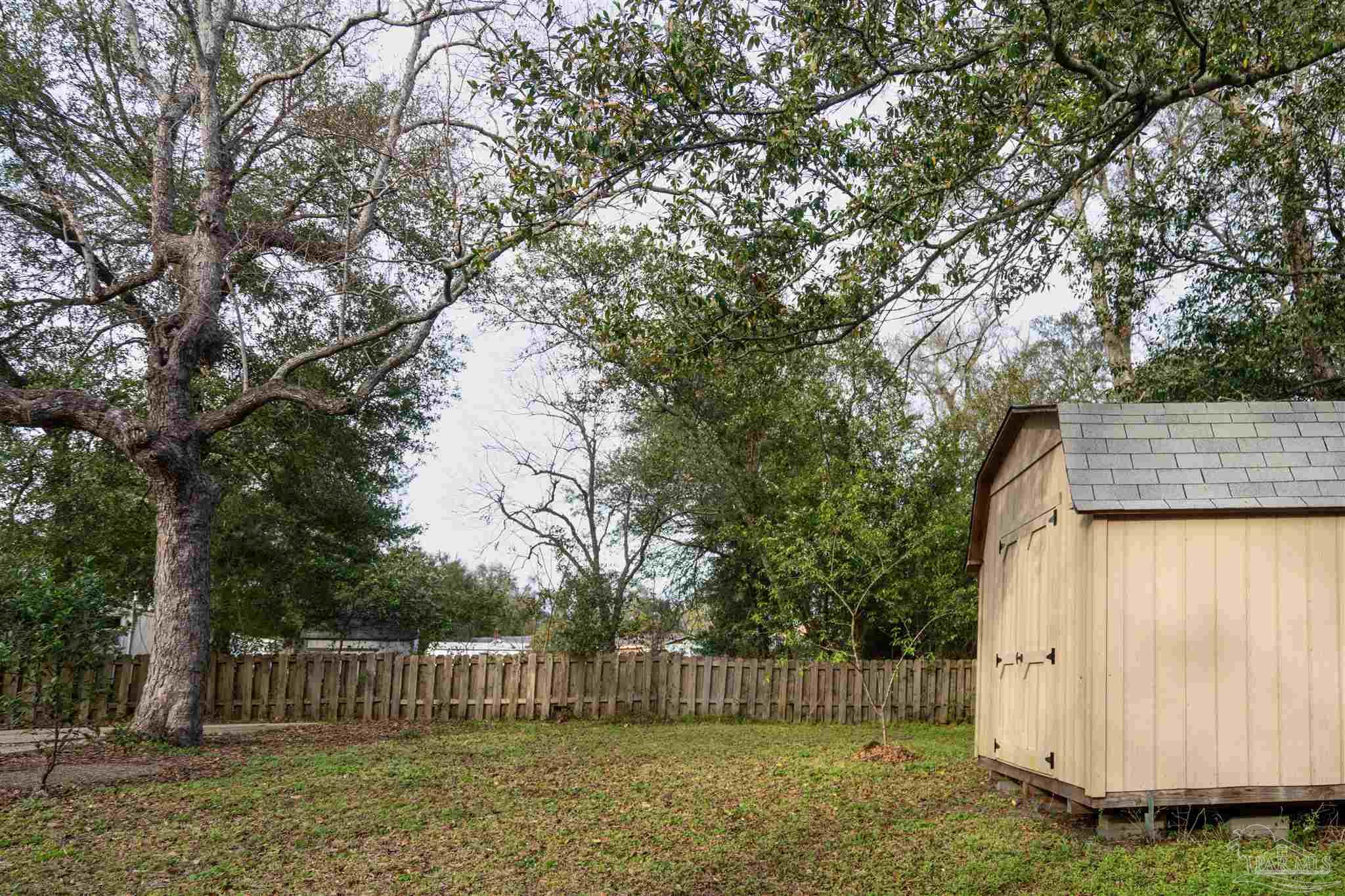 409 Frisco Road Pensacola, FL 32507 - Photo 22 of 27 a view of house with a yard