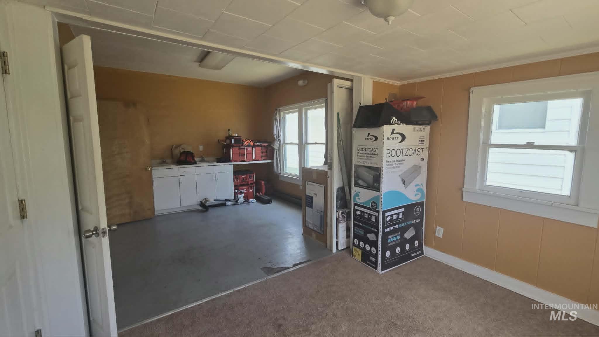 1212 Main Street Pomeroy, WA 99347 - Photo 8 of 18 Versatile interior space featuring two distinct floor finishes: carpet and painted concrete