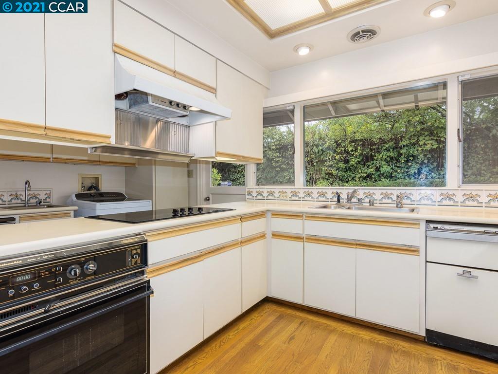 71 Orchard Road Orinda, CA 94563 - Photo 12 of 24 a kitchen with a stove a sink and a refrigerator