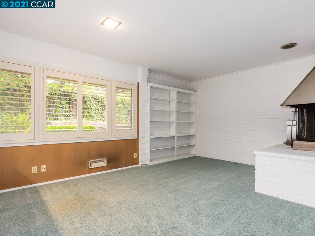 71 Orchard Road Orinda, CA 94563 - Photo 15 of 24 an empty room with a fireplace and window