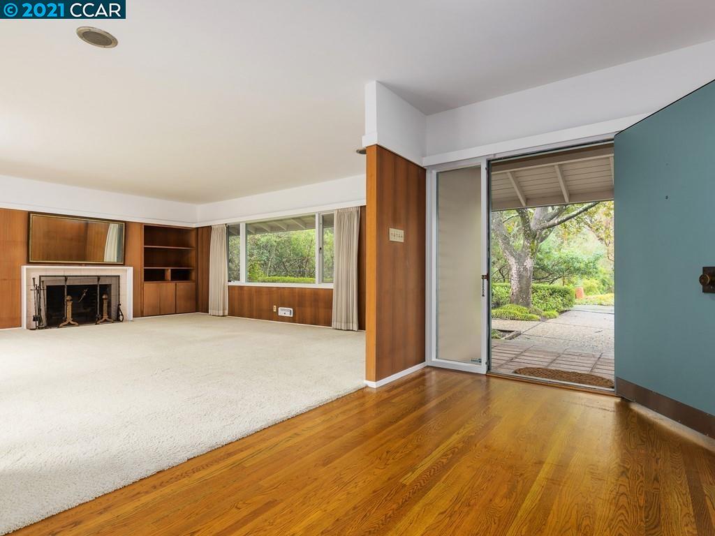 71 Orchard Road Orinda, CA 94563 - Photo 3 of 24 an empty room with wooden floor and windows