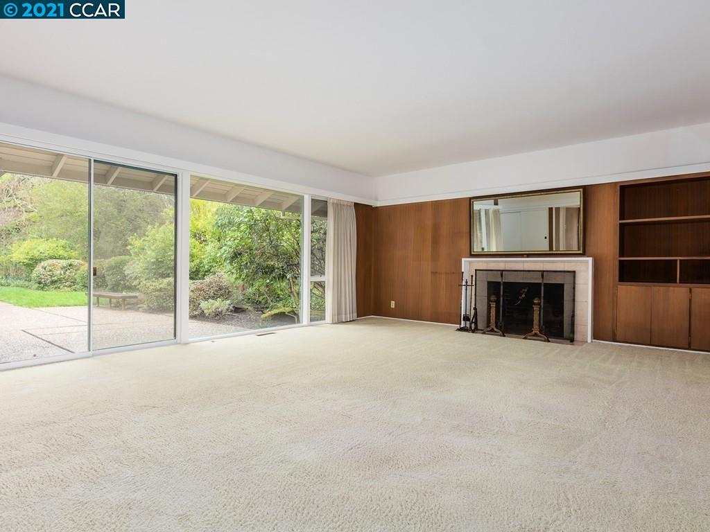 71 Orchard Road Orinda, CA 94563 - Photo 5 of 24 a view of an empty room with a fireplace and a window