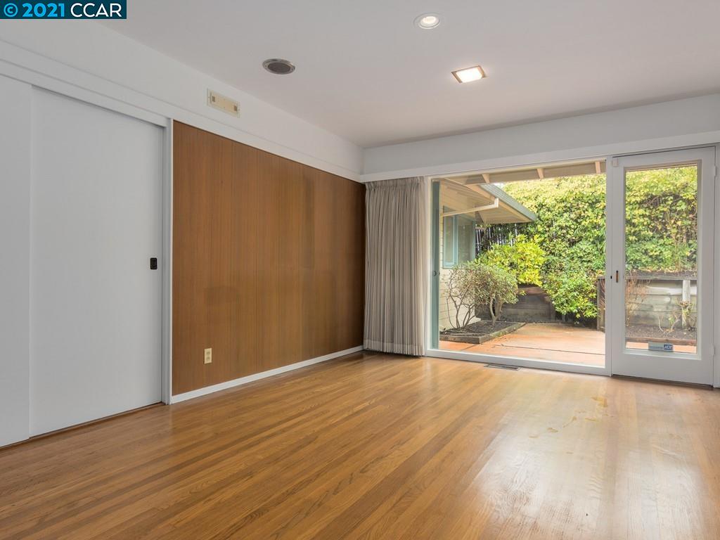 71 Orchard Road Orinda, CA 94563 - Photo 8 of 24 a view of an empty room with wooden floor and a window