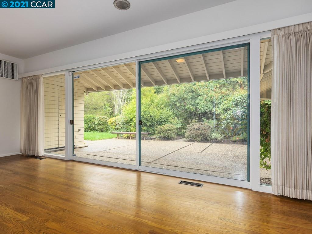 71 Orchard Road Orinda, CA 94563 - Photo 9 of 24 a view of an empty room with wooden floor and a window