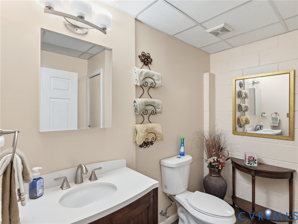 8416 Arnold Road Mechanicsville, VA 23111 - Photo 33 of 58 En-suite half bath with LVP.