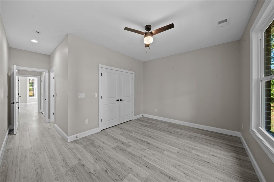105 Bree Drive Anderson, SC 29621 - Photo 29 of 48 A quiet secondary bedroom features light wood flooring and a refreshing ceiling fan.