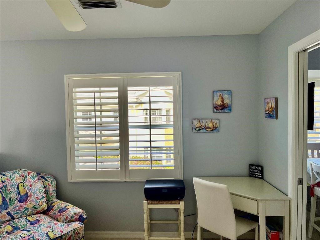 8380 Mystic Greens Way, Unit 1303 Naples, FL 34113 - Photo 11 of 25 a bedroom with a bed and a window