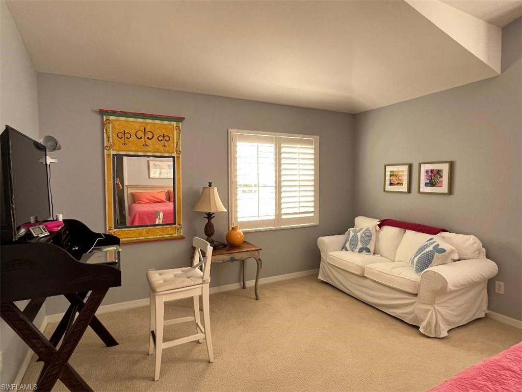 8380 Mystic Greens Way, Unit 1303 Naples, FL 34113 - Photo 15 of 25 a living room with furniture and a flat screen tv