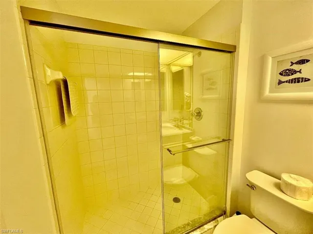 a bathroom with a blue shower curtain