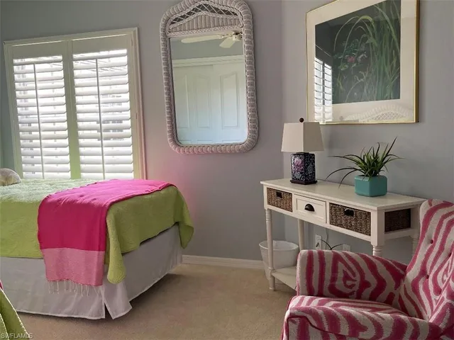 a living room with a bed furniture and a window