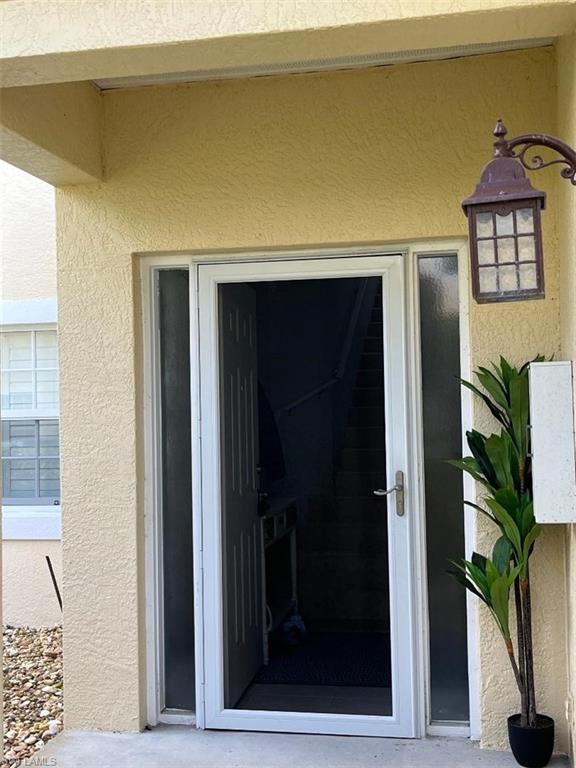 8380 Mystic Greens Way, Unit 1303 Naples, FL 34113 - Photo 22 of 25 a view of livingroom with furniture and a window