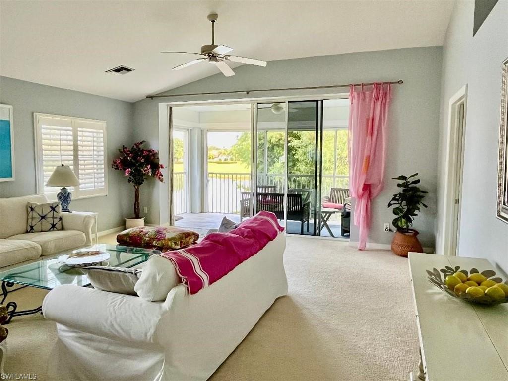 8380 Mystic Greens Way, Unit 1303 Naples, FL 34113 - Photo 3 of 25 a living room with furniture and a large windows