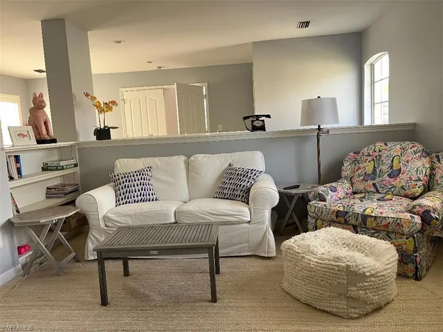 a living room with furniture and a table