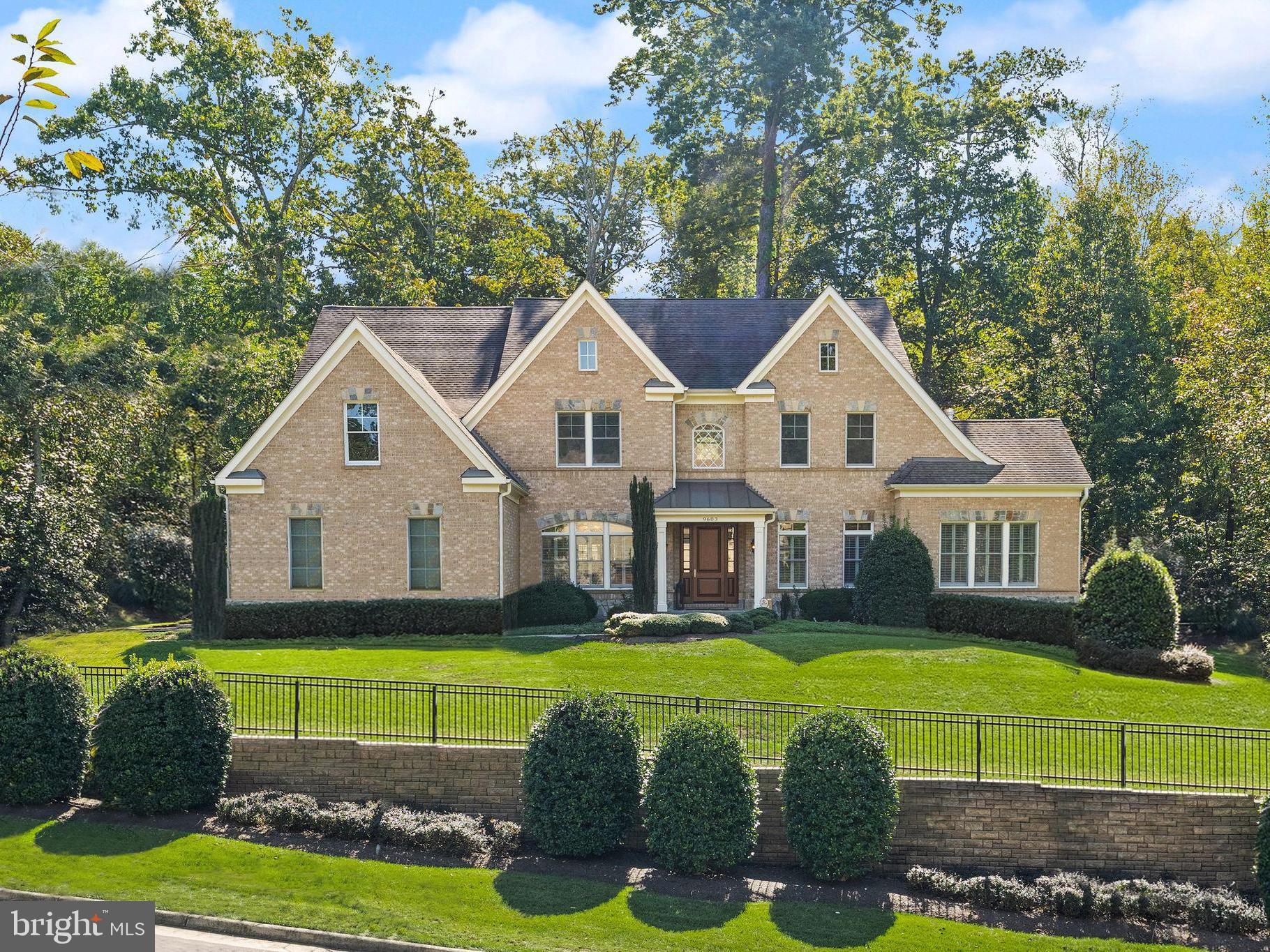 9603 Thistle Ridge Lane Vienna, VA 22182 - Photo 1 of 73 a view of a white house with a big yard and potted plants