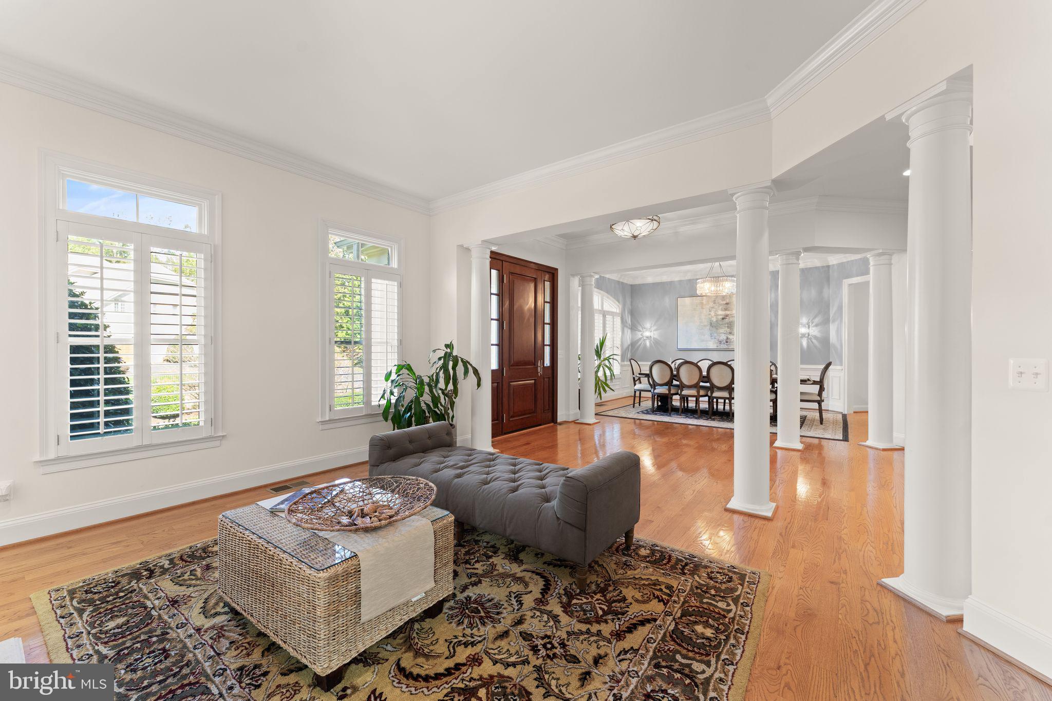 9603 Thistle Ridge Lane Vienna, VA 22182 - Photo 13 of 73 a living room with furniture and a table