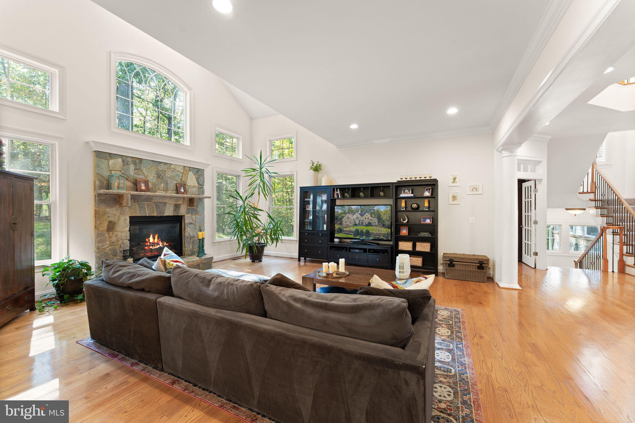 9603 Thistle Ridge Lane Vienna, VA 22182 - Photo 17 of 73 a living room with fireplace furniture and a large window