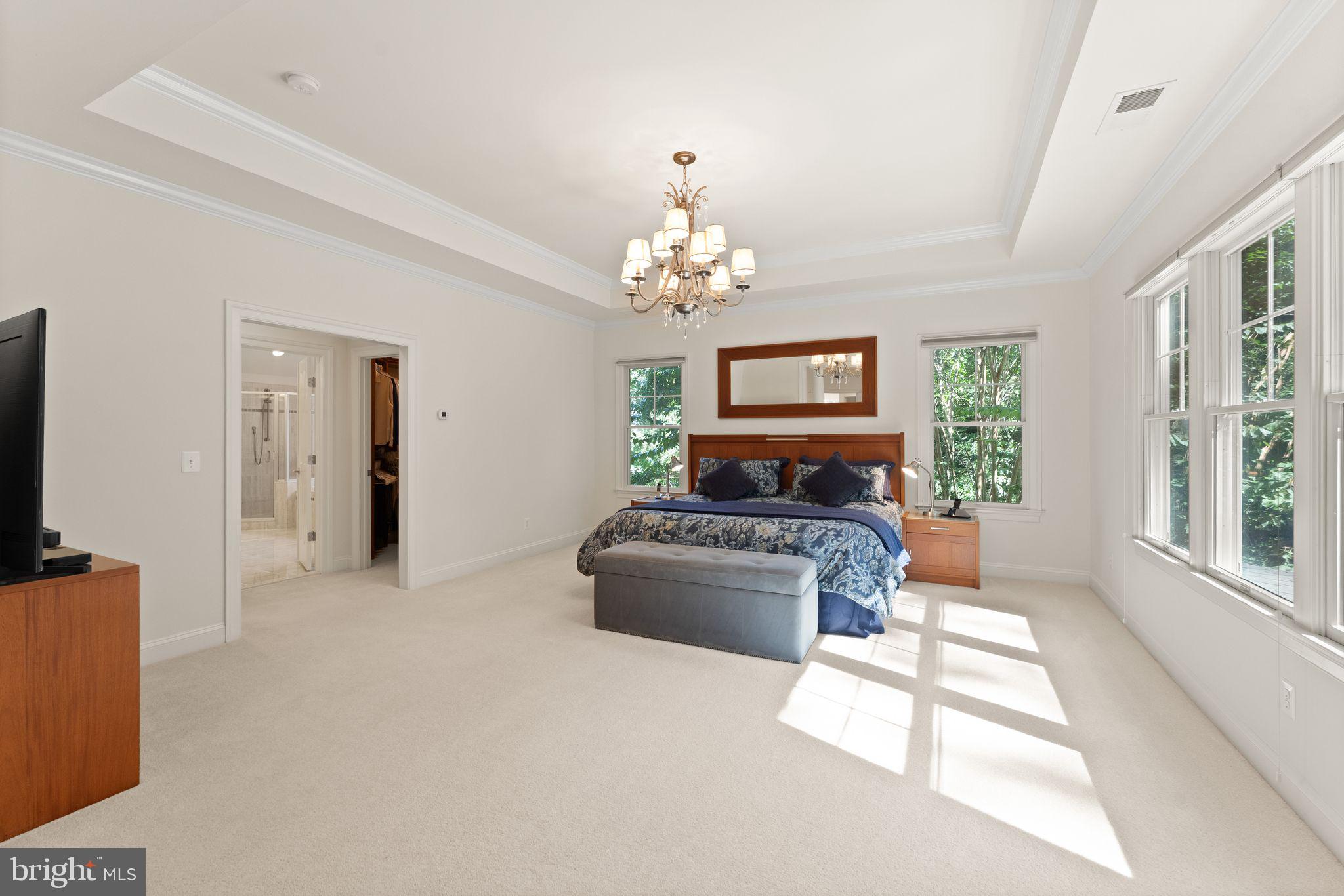 9603 Thistle Ridge Lane Vienna, VA 22182 - Photo 32 of 73 a living room with furniture and a chandelier