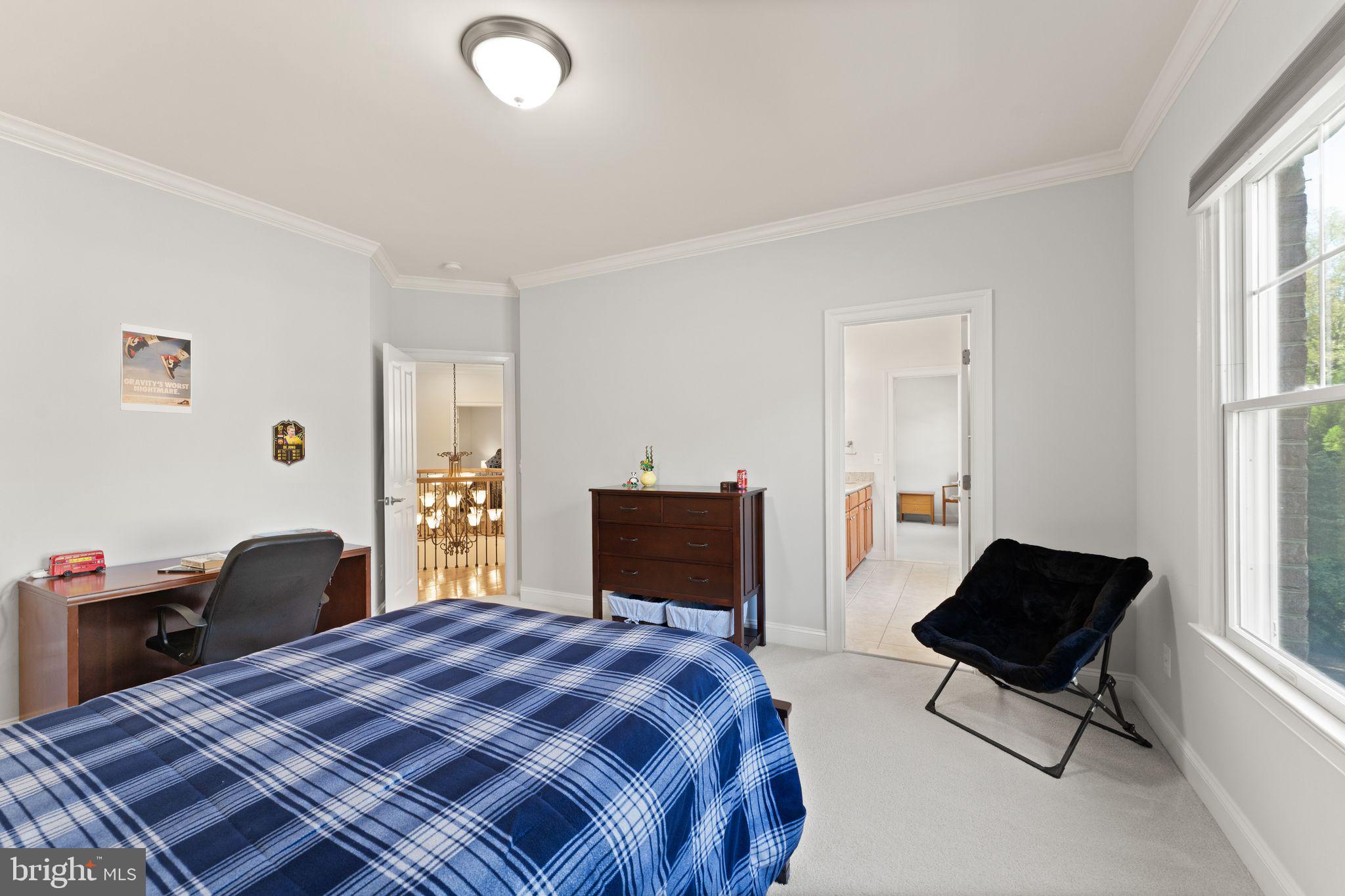 9603 Thistle Ridge Lane Vienna, VA 22182 - Photo 44 of 73 a bedroom with a bed and a window