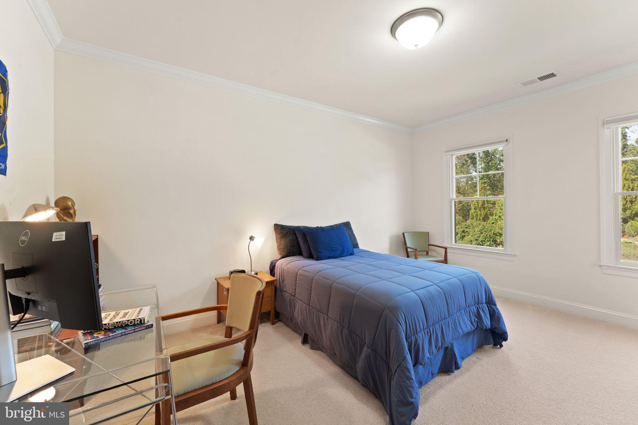 9603 Thistle Ridge Lane Vienna, VA 22182 - Photo 45 of 73 a bedroom with a bed and a window