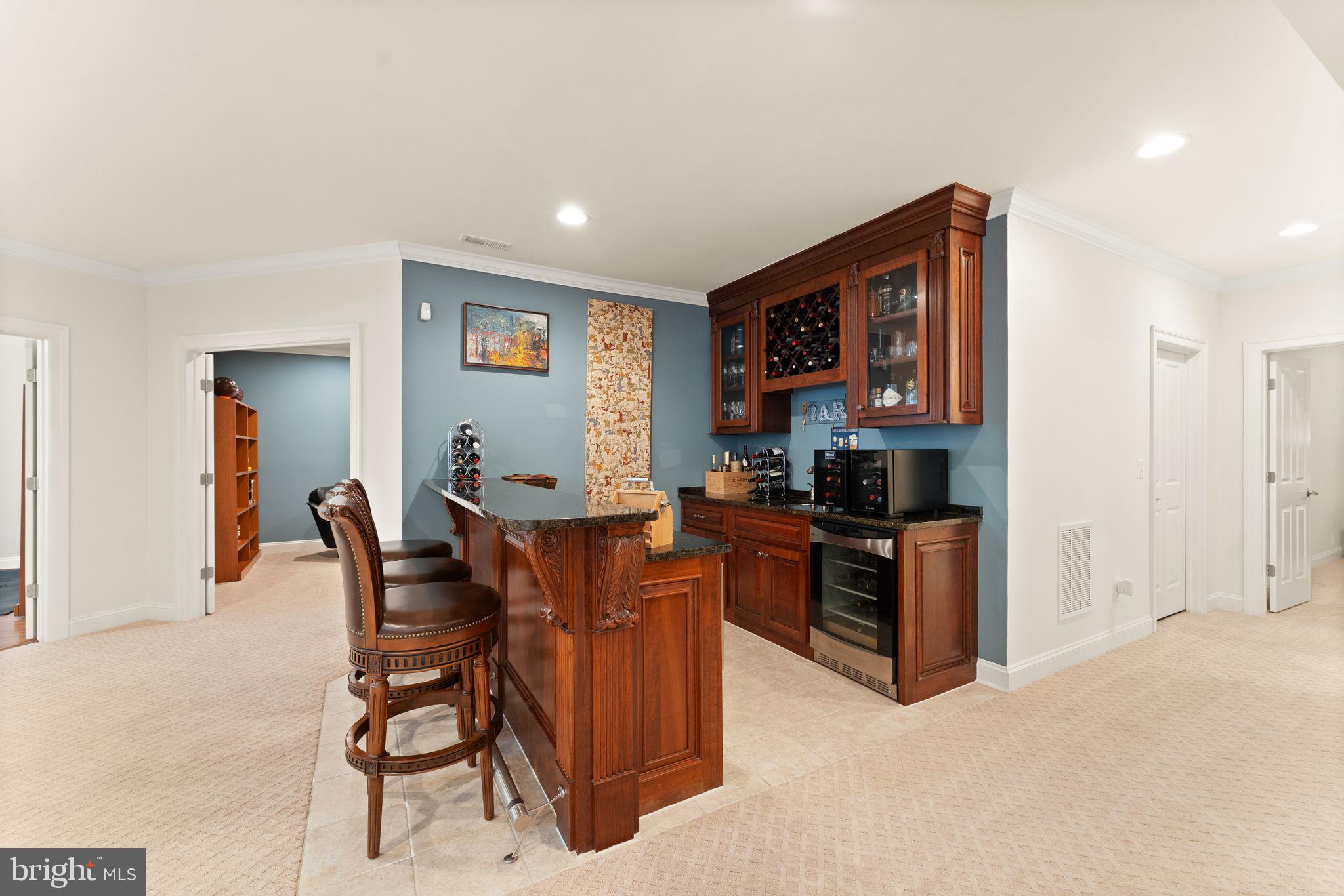 9603 Thistle Ridge Lane Vienna, VA 22182 - Photo 51 of 73 a living room with furniture a dining table and a stove top oven